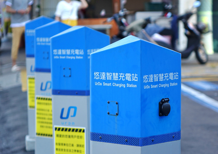 KAOHSIUNG, TAIWAN -- JULY 29, 2018: A row of electric charging stations designed for electric...