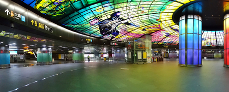 KAOHSIUNG, TAIWAN -- SEPTEMBER 13, 2018: The concourse of the Formosa Boulevard Station of the Kaohsiung MRT features a large public art glass installation.のeditorial素材