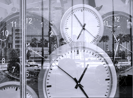 Large clocks reflecting in shop window illustrate the concept of timeの写真素材