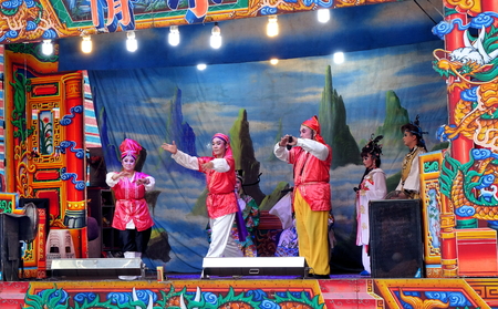KAOHSIUNG, TAIWAN -- OCTOBER 26, 2018: Taiwan folk opera is performed in an outdoor public space as part of a temple celebration.のeditorial素材