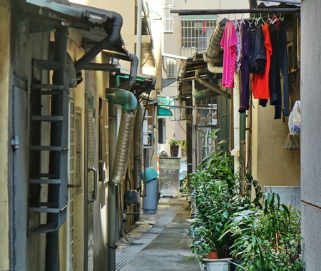 Narrow backstreet lane in a city in Taiwanの写真素材