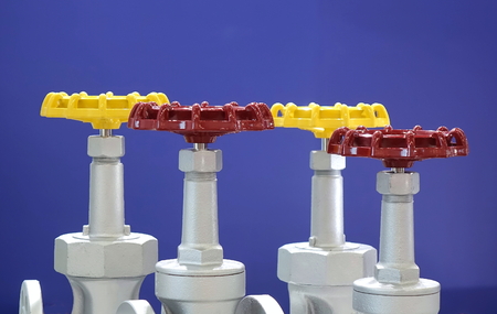 Red and yellow hand wheels for industrial valvesの写真素材