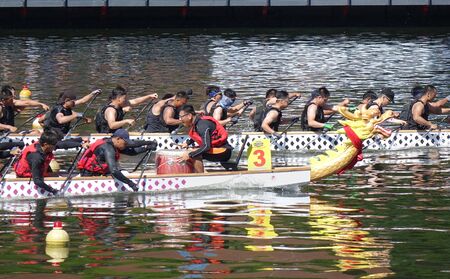 KAOHSIUNG, TAIWAN -- JUNE 7, 2019: Teams compete in the yearly  Love River dragon boat races.のeditorial素材