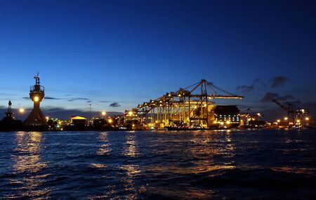 KAOHSIUNG, TAIWAN -- JUNE 2, 2019: A view of the busy Kaohsiung container shipment port at evening time.のeditorial素材