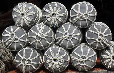 A store for boat supplies sells large fishing buoys with ropesの写真素材
