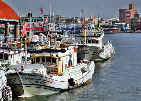KAOHSIUNG, TAIWAN -- JUNE 27, 2019: Traditional Chinese fishing boats are anchored at the Gushan Ferry Pier.のeditorial素材