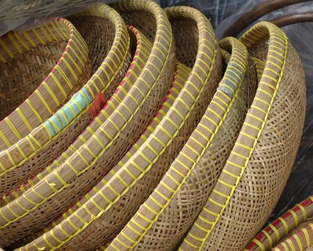 Handcrafted wicker baskets and trays at an outdoor marketの写真素材