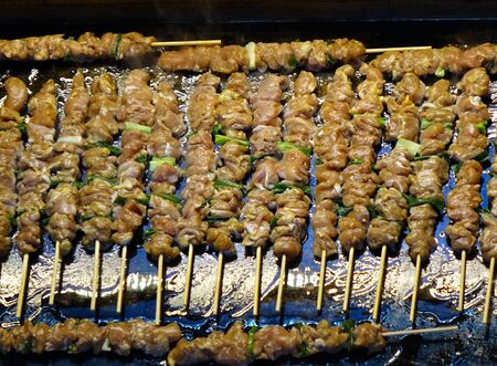 A street food stall in Taiwan offers fresh meat skewersの写真素材