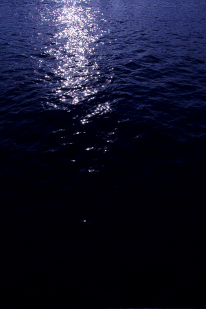Light reflected on the water surfaceの写真素材