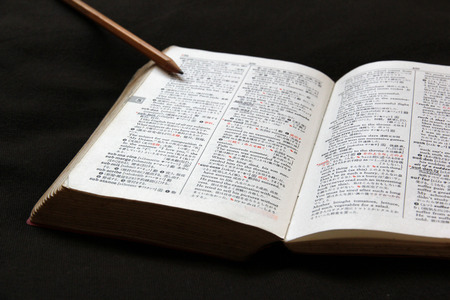 Dictionary and pencilの写真素材