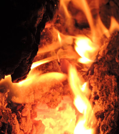 Warm orange flame furnace hot sparks logs