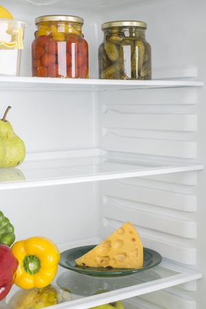 Open fridge full of fresh fruits and vegetables, healthy food background, organic nutrition, health care, dieting conceptの写真素材