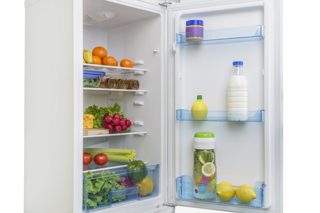 Open fridge full of fresh fruits and vegetables, healthy food background, organic nutrition, health care, dieting conceptの写真素材