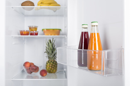 Open fridge full of fresh fruits and vegetables, healthy food background, organic nutrition, health care, dieting conceptの写真素材