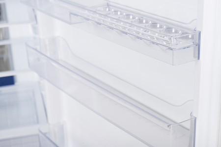 New Refrigerator Isolated on White Background. Modern Kitchen and Domestic Major Appliancesの写真素材