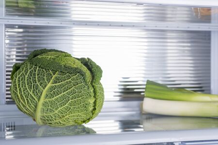 Open fridge full of fresh fruits and vegetables, healthy food background, organic nutrition, health care, dieting conceptの写真素材