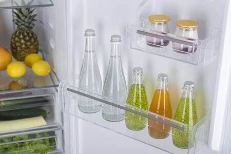 Open fridge full of fresh fruits and vegetables, healthy food background, organic nutrition, health care, dieting conceptの写真素材
