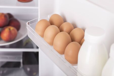 Open fridge full of fresh fruits and vegetables, healthy food background, organic nutrition, health care, dieting conceptの写真素材