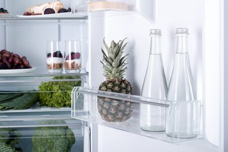 Open fridge full of fresh fruits and vegetables, healthy food background, organic nutrition, health care, dieting conceptの写真素材