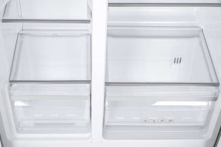 New Refrigerator Isolated on White Background. Modern Kitchen and Domestic Major Appliancesの写真素材