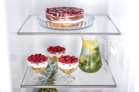Open fridge full of fresh fruits and vegetables, healthy food background, organic nutrition, health care, dieting conceptの写真素材