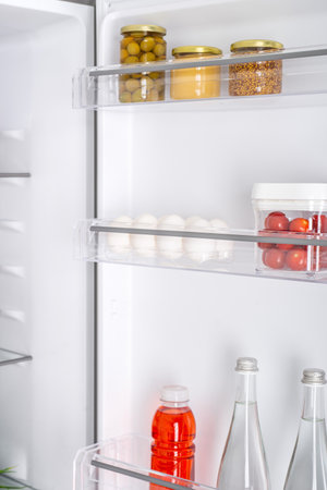 Open fridge full of fresh fruits and vegetables, healthy food background, organic nutrition, health care, dieting conceptの写真素材