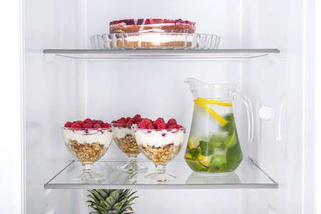 Open fridge full of fresh fruits and vegetables, healthy food background, organic nutrition, health care, dieting conceptの写真素材