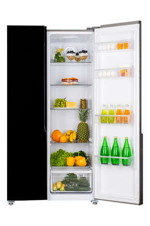 Open fridge full of fresh fruits and vegetables, healthy food background, organic nutrition, health care, dieting conceptの写真素材