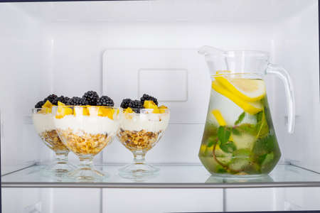 Open fridge full of fresh fruits and vegetables, healthy food background, organic nutrition, health care, dieting conceptの写真素材