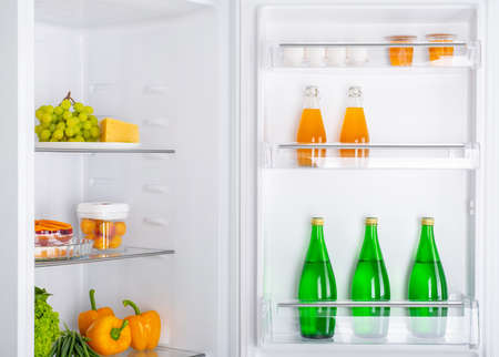 Open fridge full of fresh fruits and vegetables, healthy food background, organic nutrition, health care, dieting conceptの写真素材