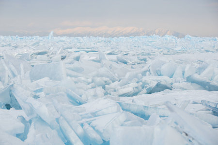 Field of cracked ice hummocks in evening light. Lake Baikal, Siberia.の写真素材