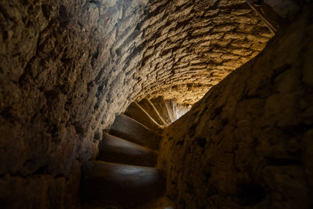 Weathered spiral stairway. Interior of old medieval asian minaretの写真素材