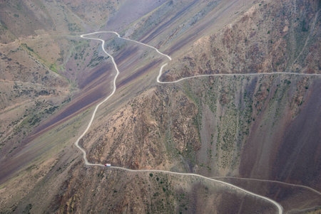 Big track on the long winding high mountain roadの写真素材
