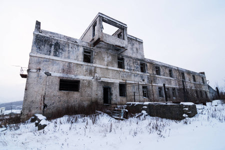 Abandoned settlement with decayed buildings in Kolyma winter viewの写真素材