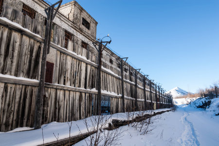 Decayed wooden fence of abandoned prison in Kolymaの写真素材