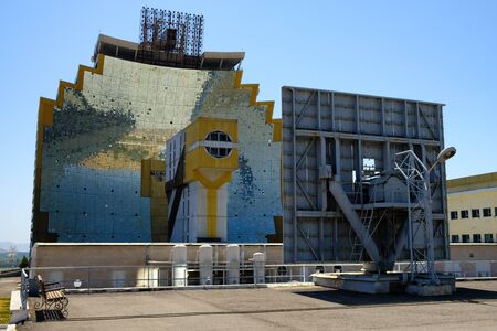 Parabolic helioconcentrator and heliostat â the main parts of solar furnace. Abstract futuristic background.の写真素材