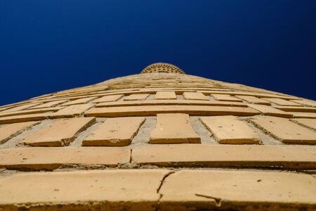 Brick wall of ancient minaret in Uzbekistan. Close-up view. Central Asia travel viewの写真素材