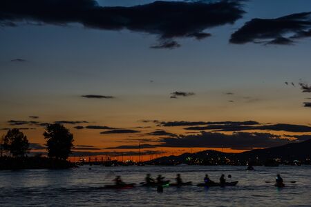 Boats and yachts in the bay at sunsetの写真素材