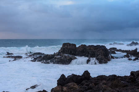 A powerful storm in the Atlantic Ocean in a bay on the coast of Tenerife.