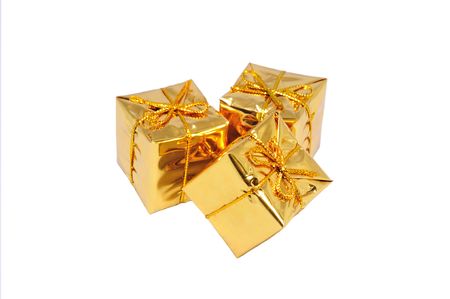 heap of three isolated small yellow giftsの写真素材