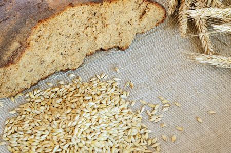 Bread and cereals on the burlap background