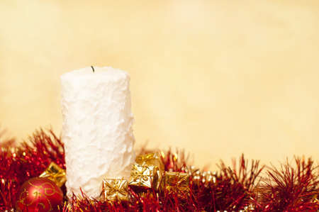 bright christmas background with a white candleの写真素材