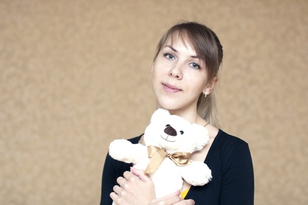 portrait of a woman with a toy bearの写真素材