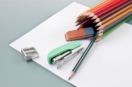 School supplies on a white paper outgoing of colored pencils tubeの写真素材