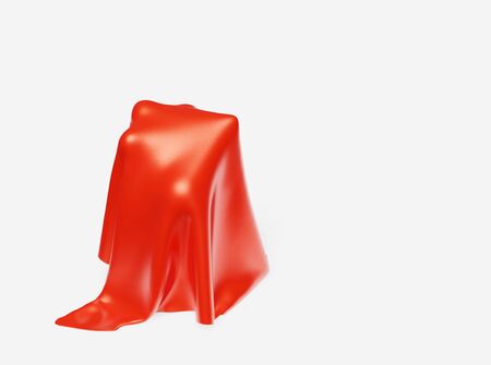 A big Trophy under a Red Fabric piece with a White Backgroundの写真素材