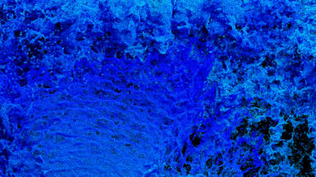 Millions of Tiny Blue Particles Filling the screen with Splashes on a Black backgroundの写真素材