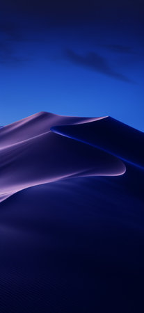 Portrait of a Dunes landscape in a blue and dark purple light night with some soft clouds in a dark skyの素材