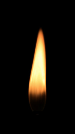 Close-up of Isolated Straight Quiet and Perfect Candle Flame on a Black Background
