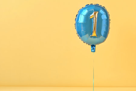 Pastel colors, the letter "1" from a gold foil balloon on a white minimalist background with space for text.の素材