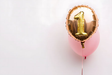 Pastel colors, the letter "1" from a gold foil balloon on a white minimalist background with space for text.の素材